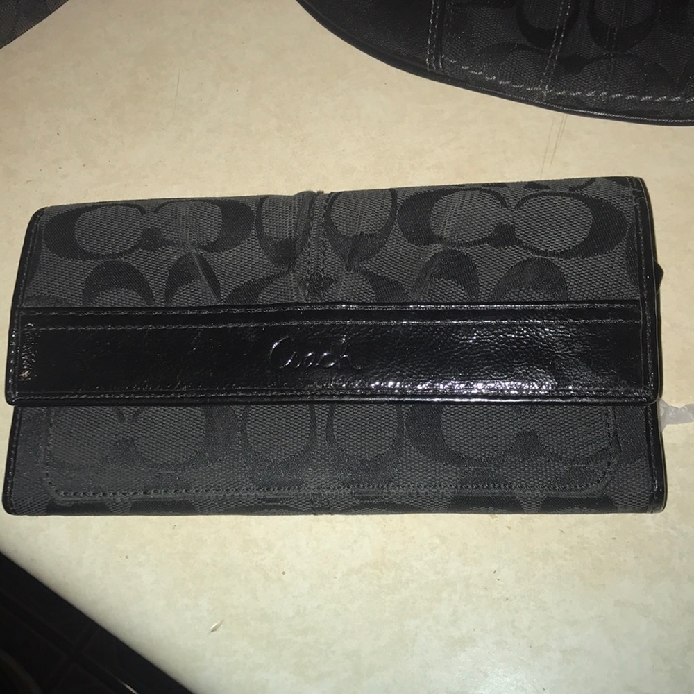 Black signature Coach wallet.  Authentic.